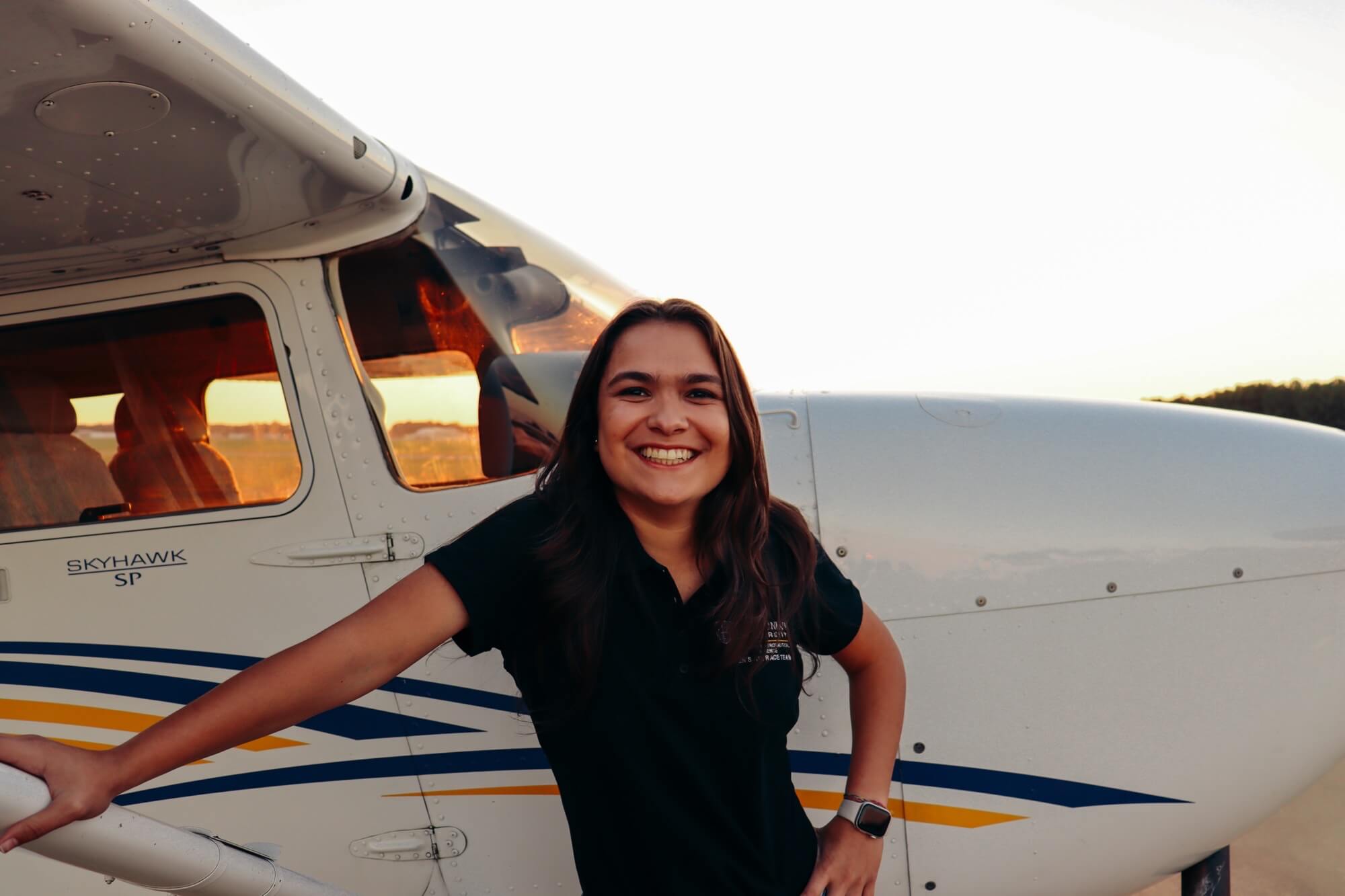 woman in front of plane