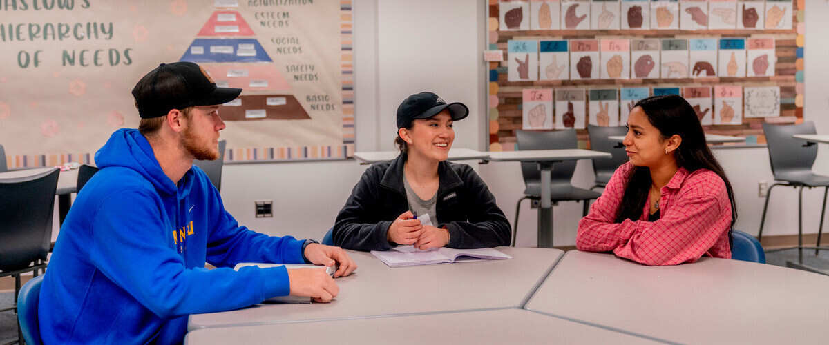 Three students at a table