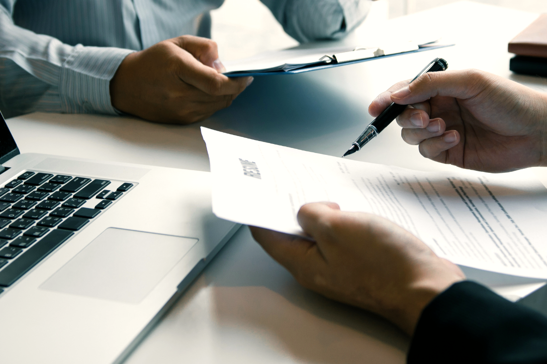 Financial documents being reviewed at a desk